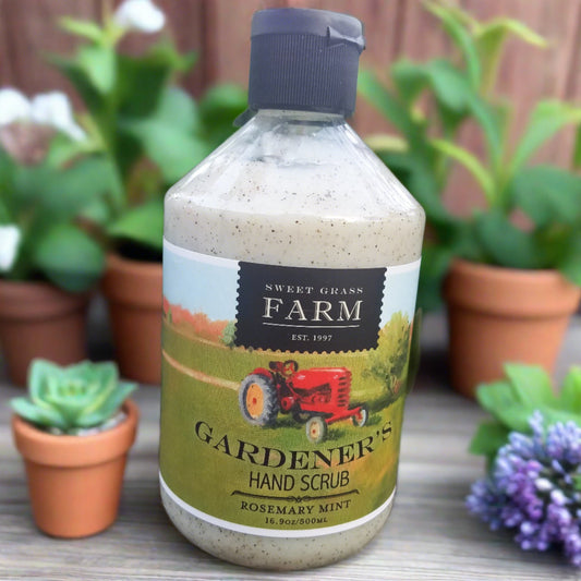 16.9 oz Gardener's Hand Scrub Rosemary Mint scented. Shown with a floral background.