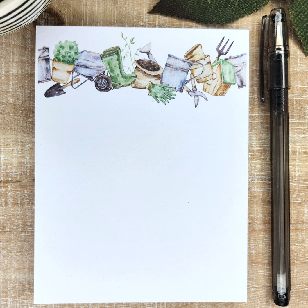 Gardening notepad featuring gardening tools along the top in banner form